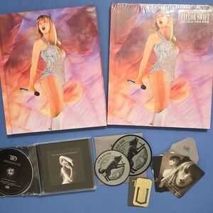 (2) Taylor Swift The Eras Tour Books and 1 TTPD CD Set